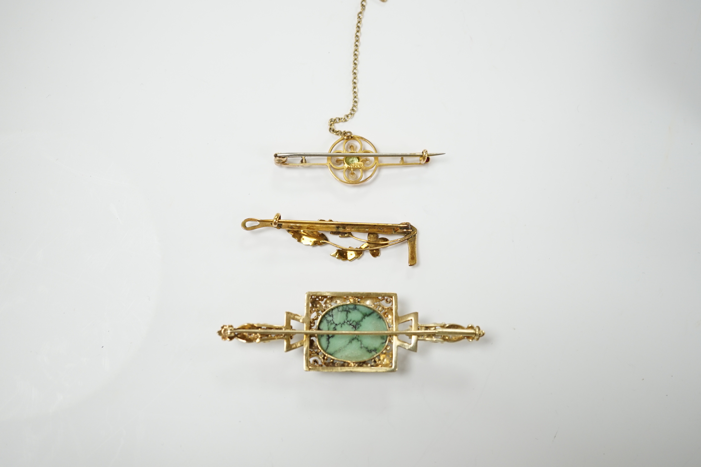 A modern 9ct gold, turquoise and diamond set bar brooch, 69mm and two Edwardian 9ct and gem set bar brooches, including seed pearl set riding crop and spray brooch, gross weight 14.1 grams.